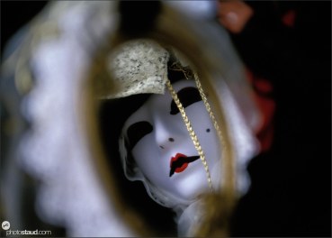 Carnival Mask reflecting in mirror, Venice, Italy